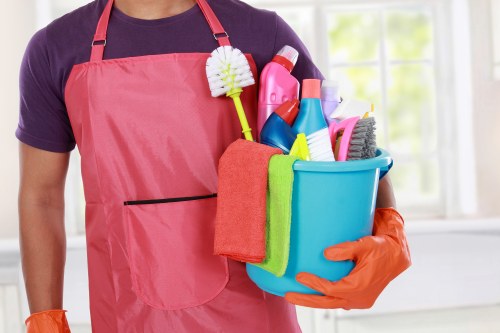 Carpet cleaning technician using safety-focused procedures inside a home